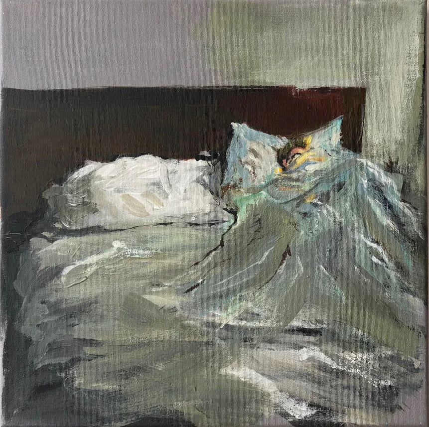 Cynthia under the covers on her iPhone