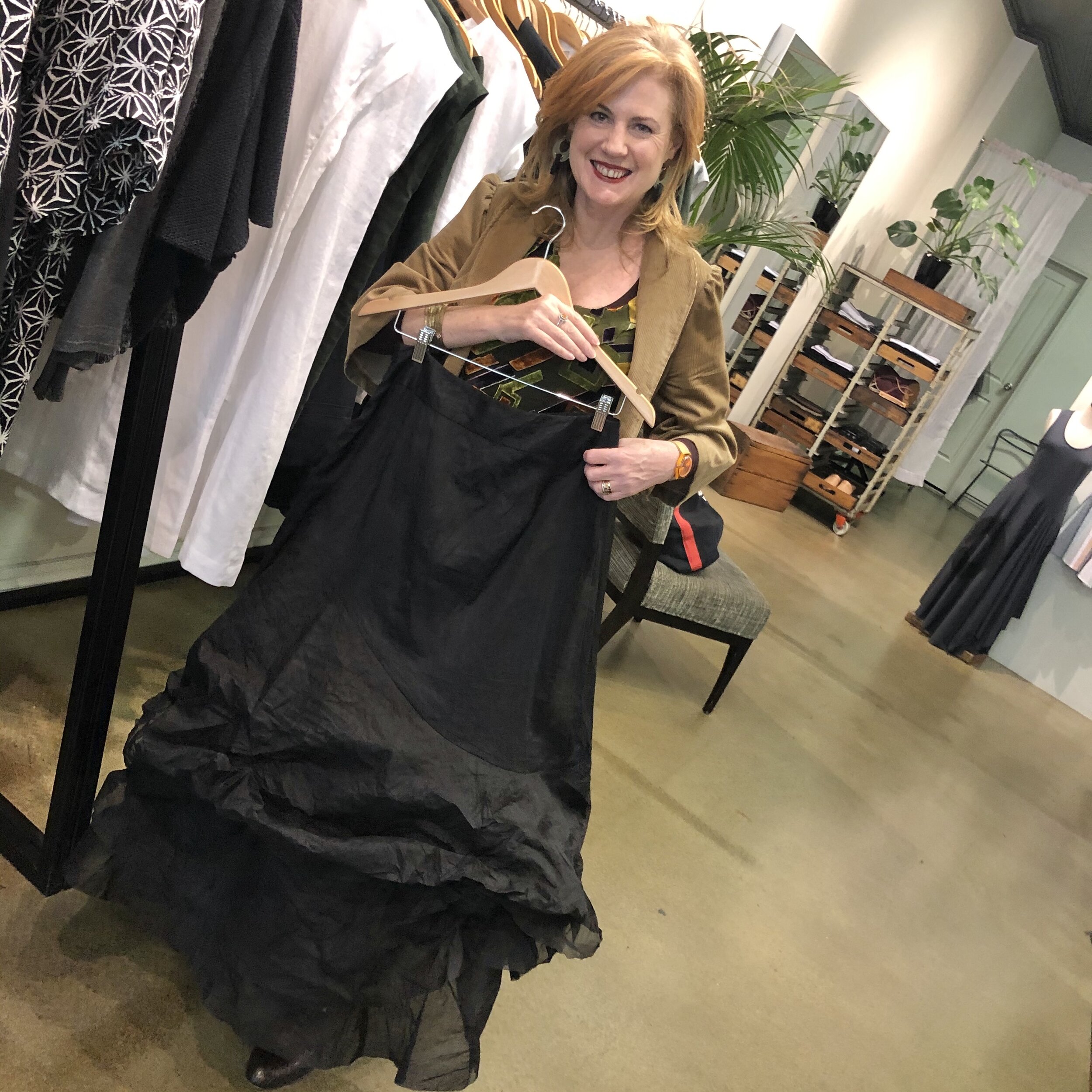 Donna showing an ethically made black skirt