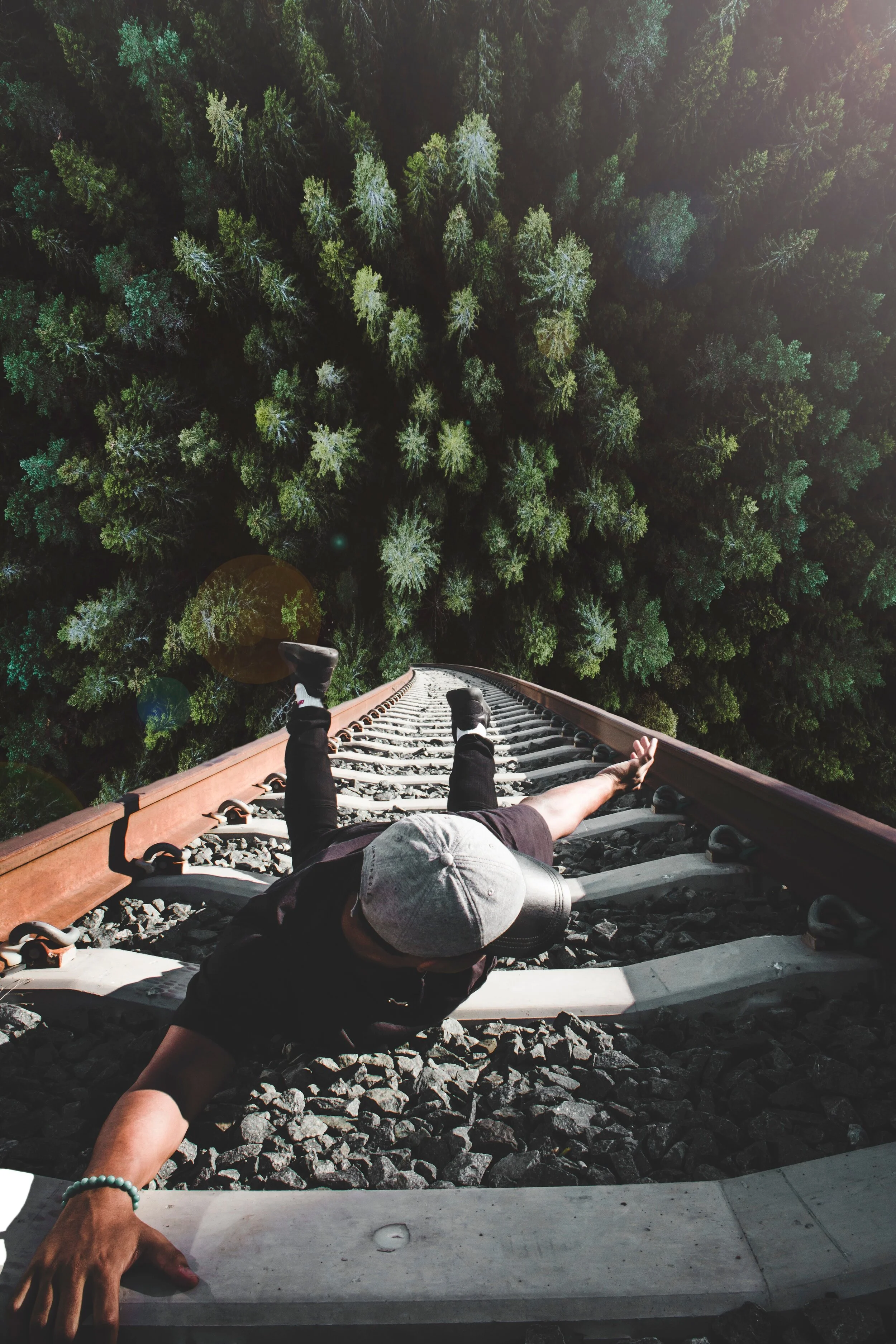 man-holding-on-gray-railing-1732370.jpg
