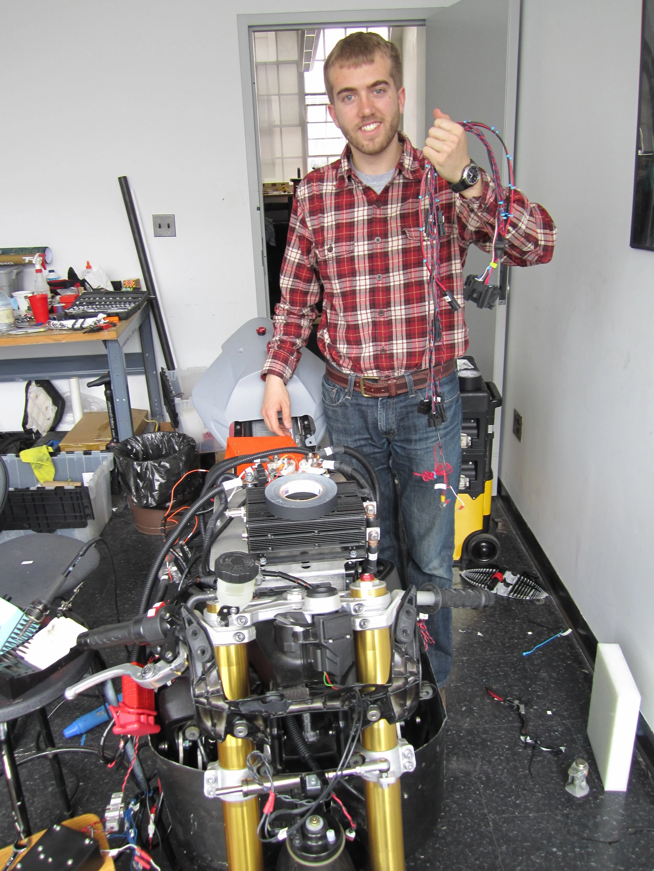  I helped choose the electric motors for the race bike and designed and programmed the rider interface that communicated with and controlled the various onboard systems. This custom interface gave the rider the complete status of the bike and allowed