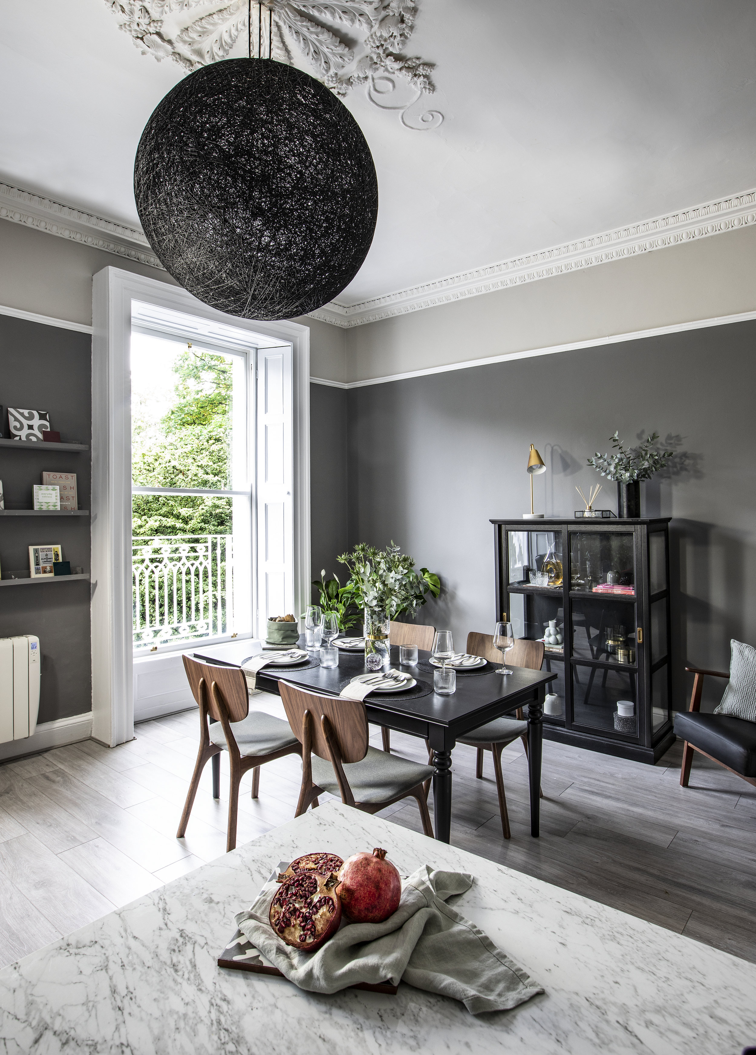 grey and black kitchen with big black sphere lamp shade