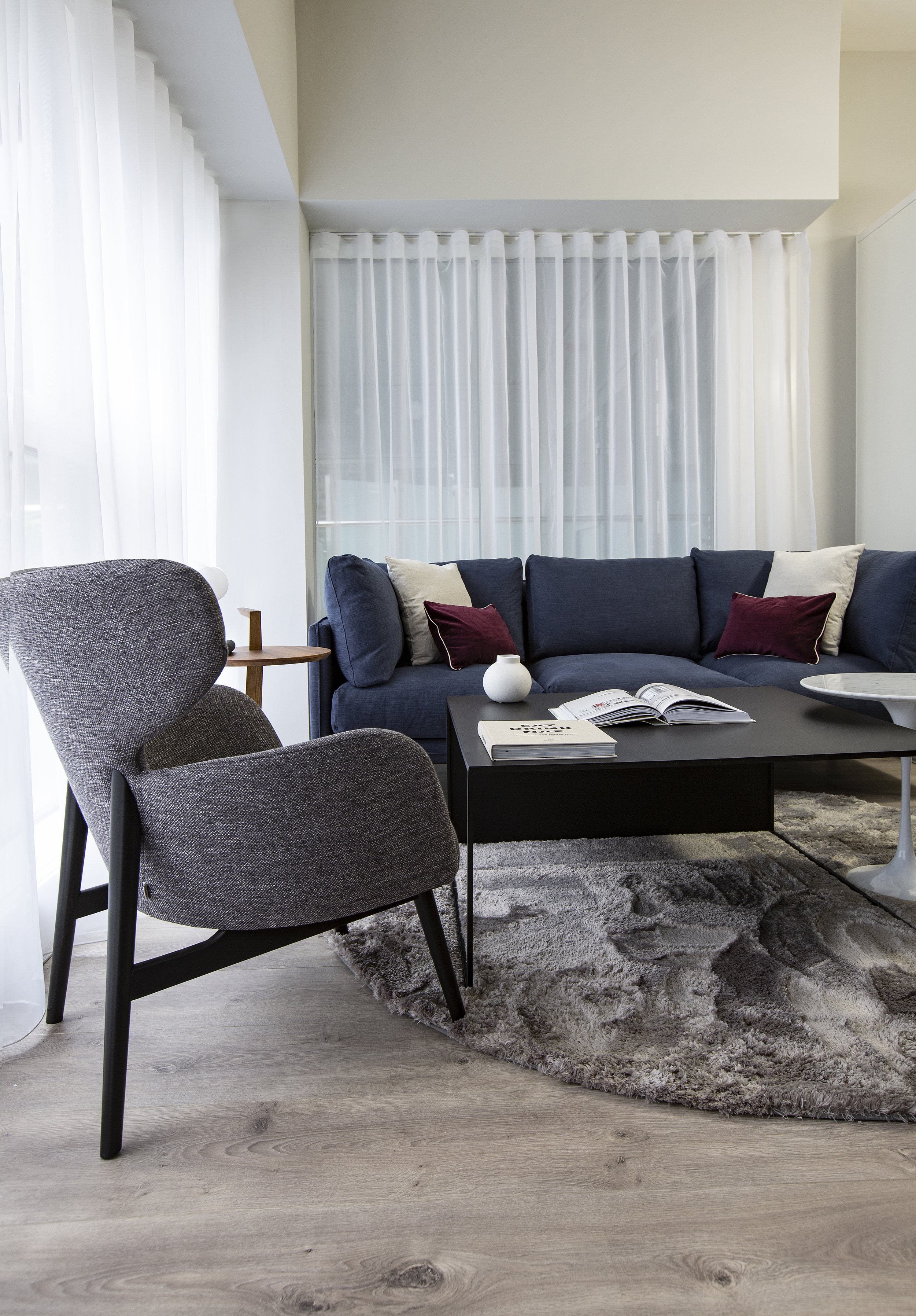 Hanover court with park developments. blue couch and circle marble rug