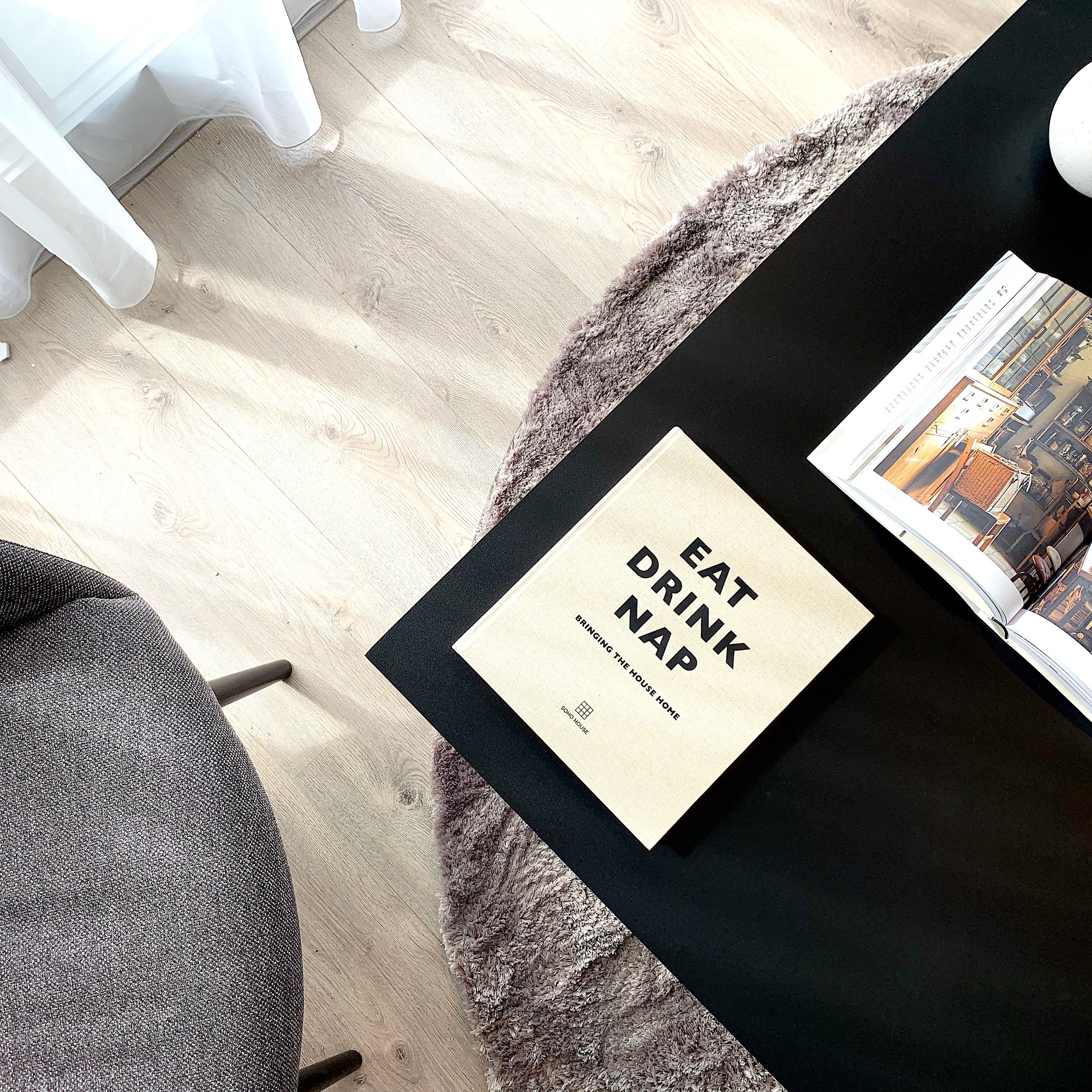 Hanover court with park developments. black coffee table with white books