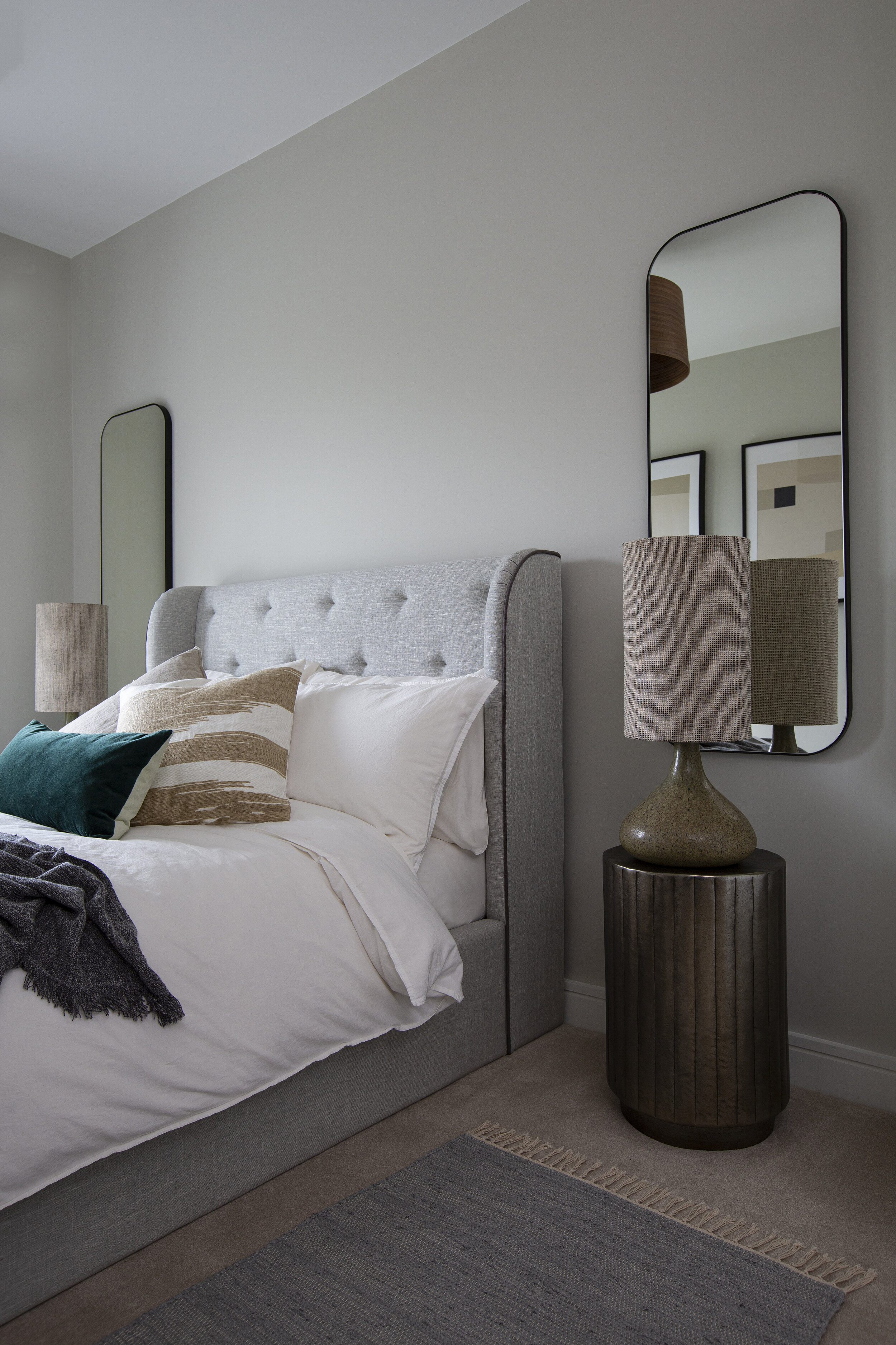 grey padded bed frame 