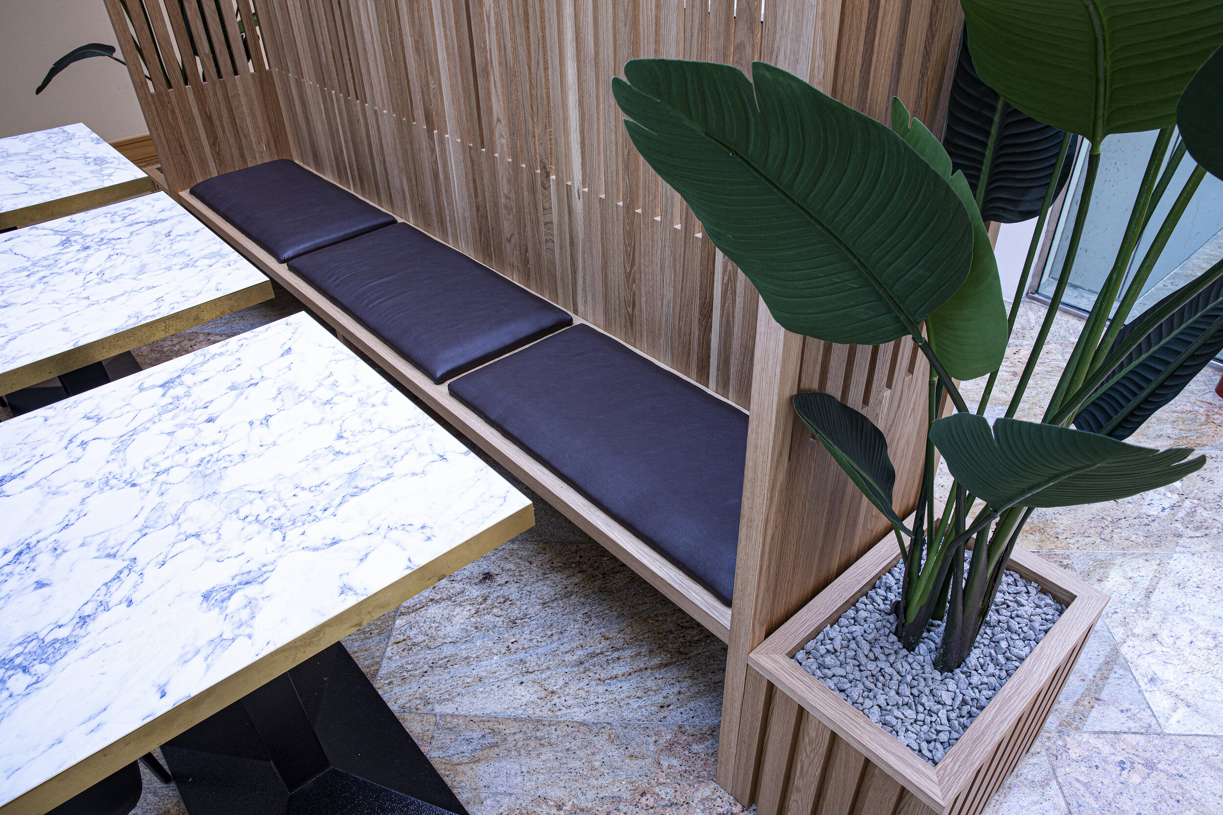 floating black cushioned bench