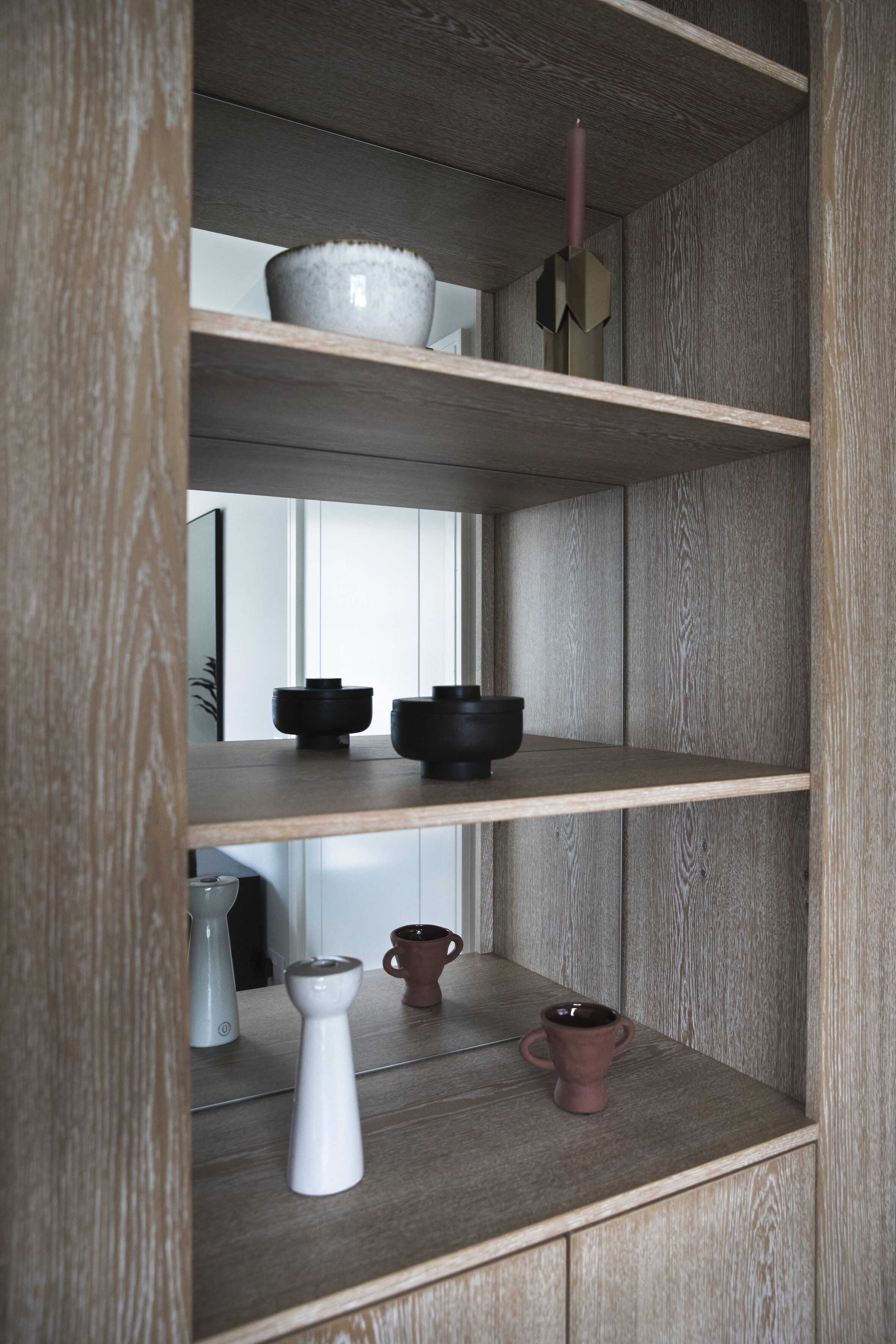 mirror backed wooden shelves