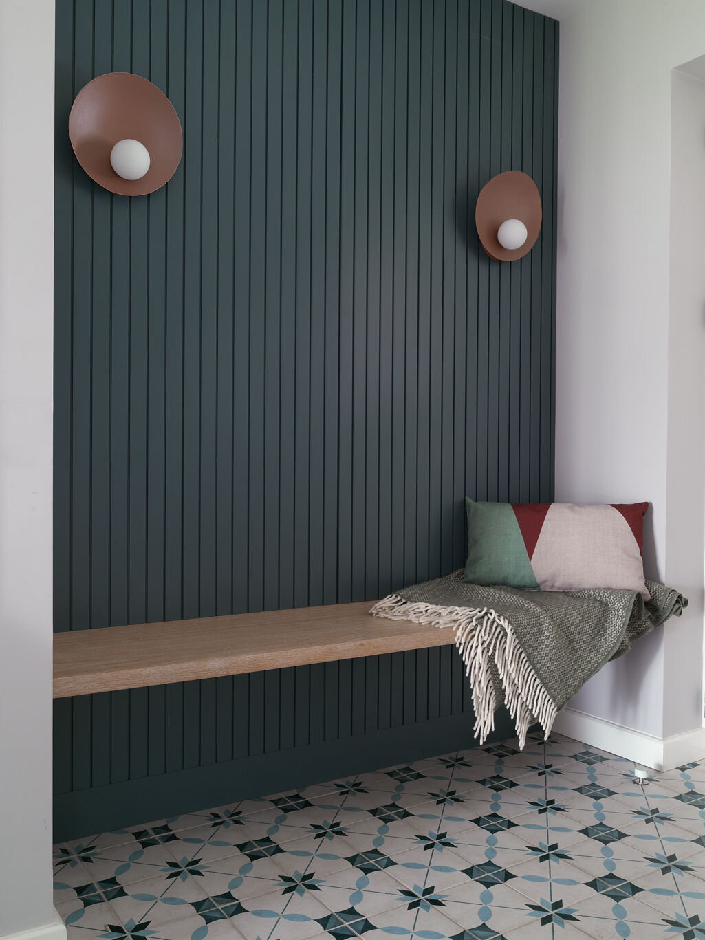 tongue and groove blue panelled wall with floating plank bench
