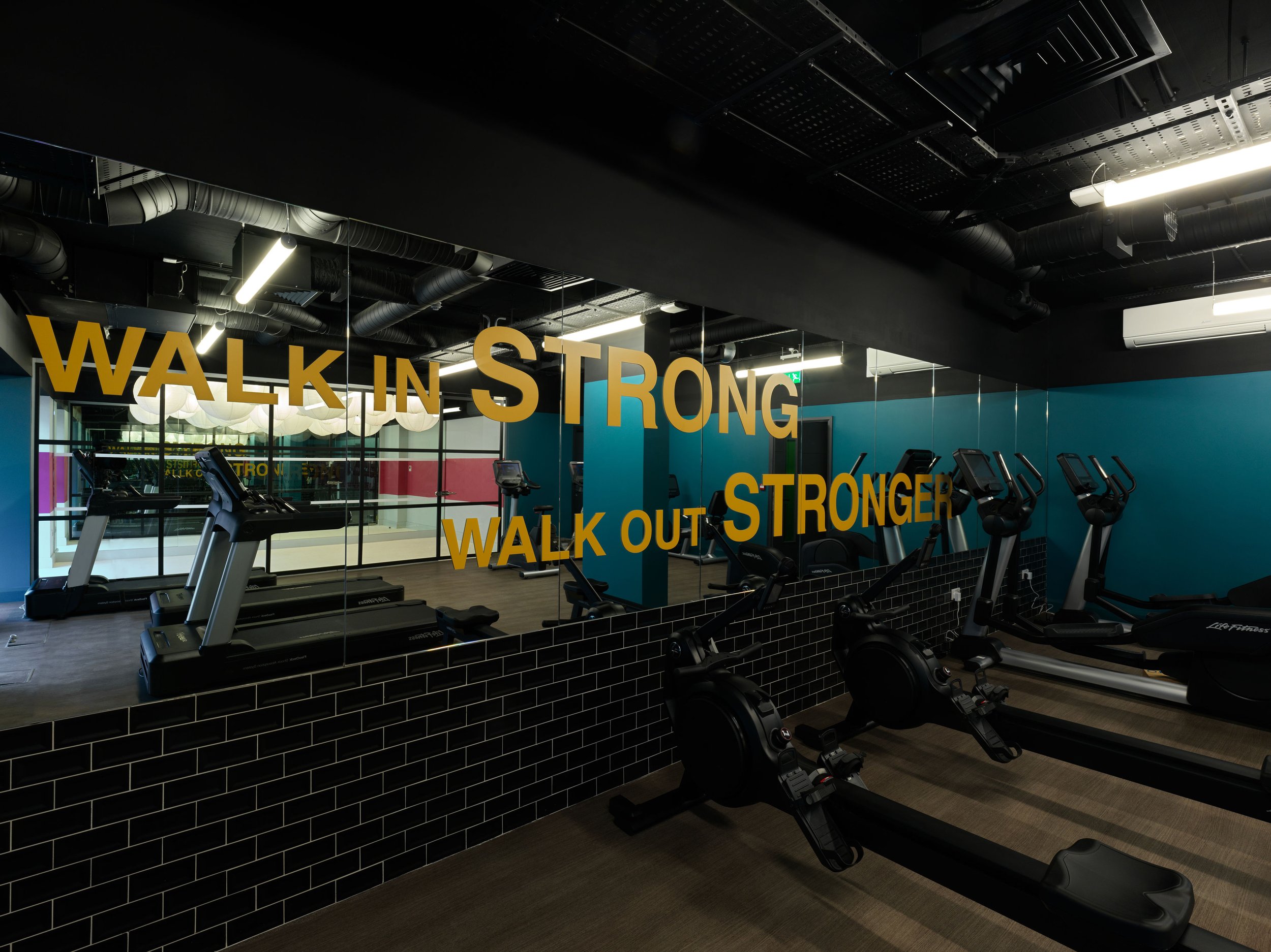 gym with wall to wall mirror