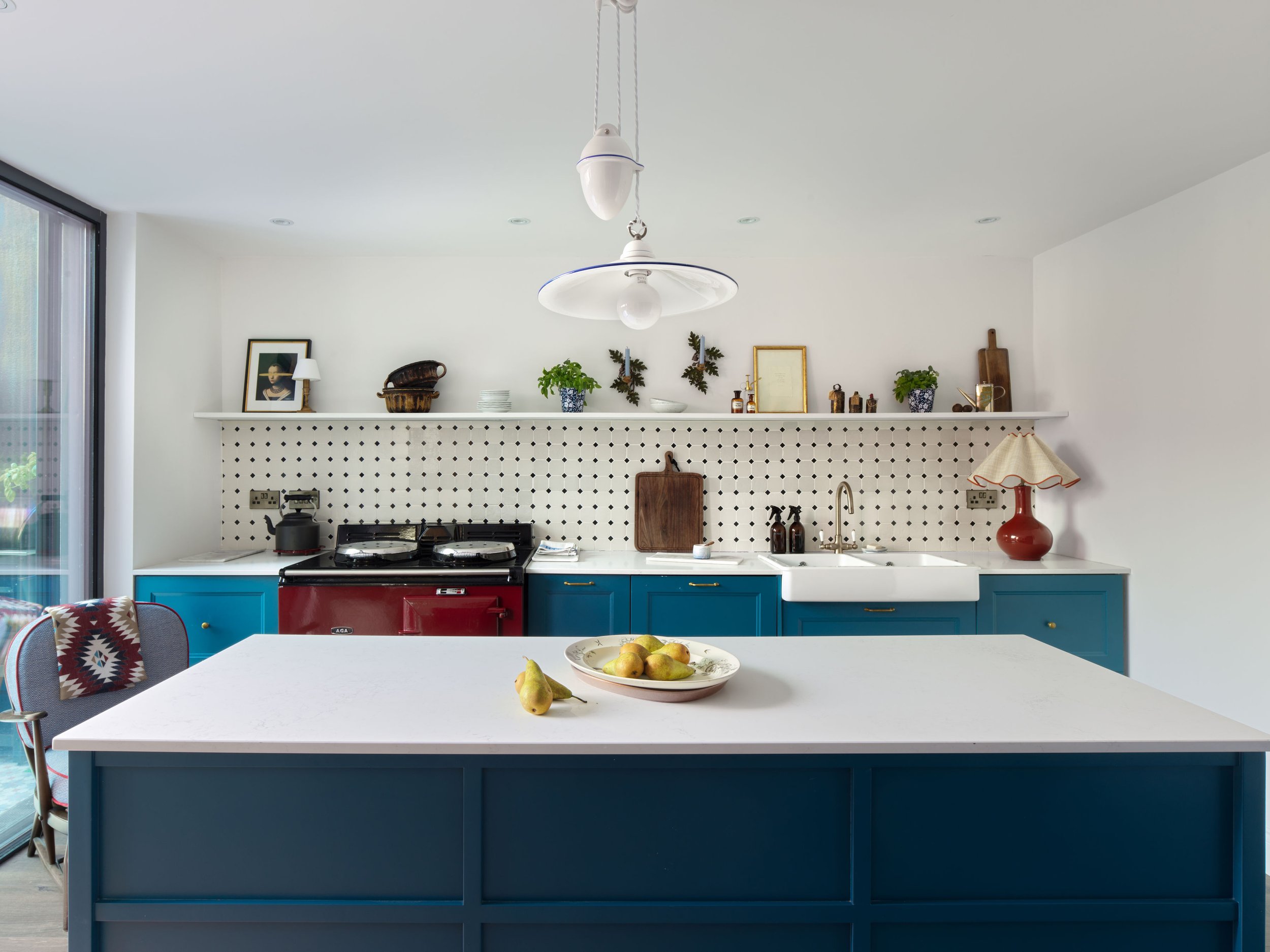 blue kitchen with small tile pattern backsplash