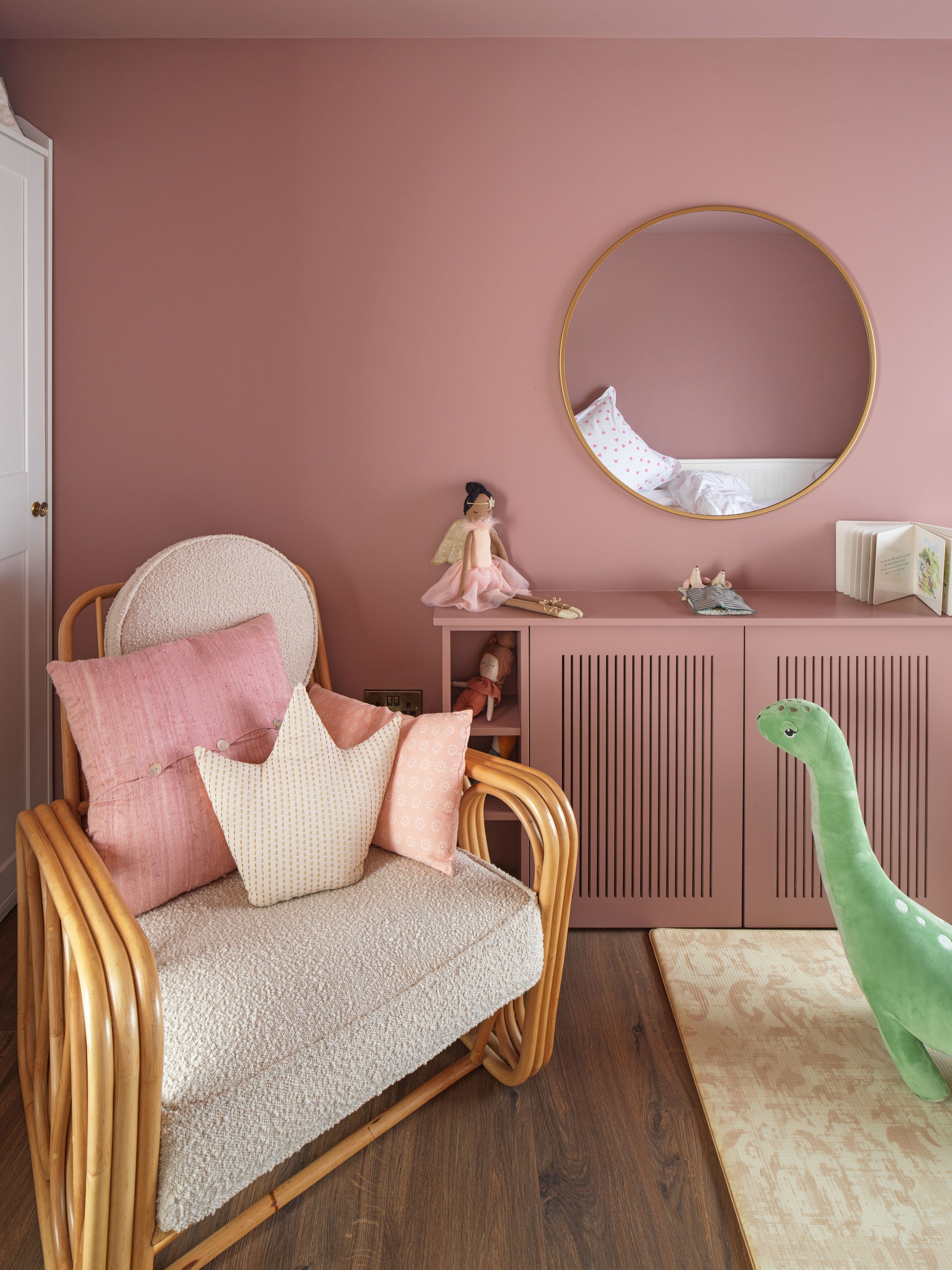 pink children's room with rocking chair