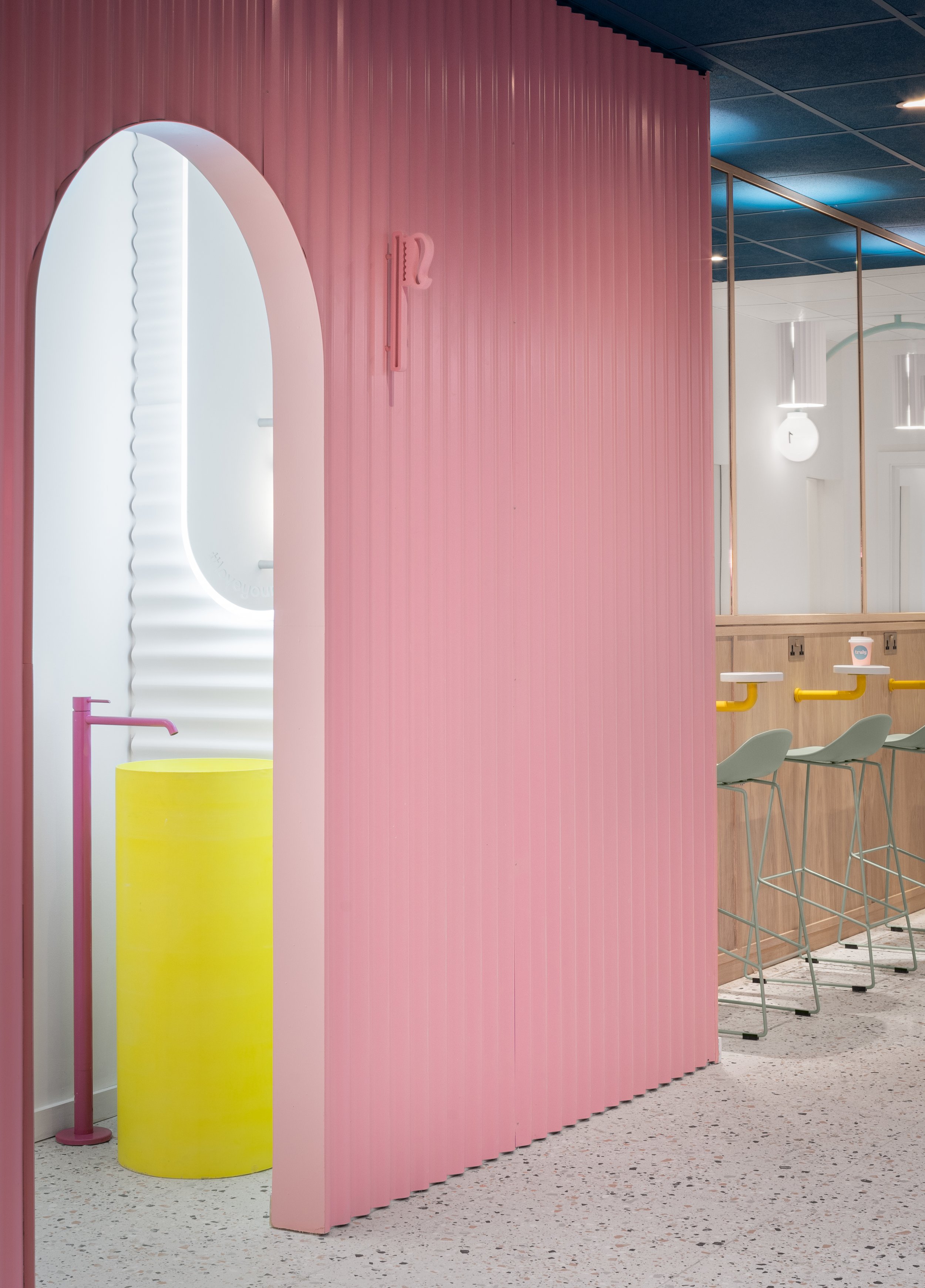 pink interior corrugated tile arch