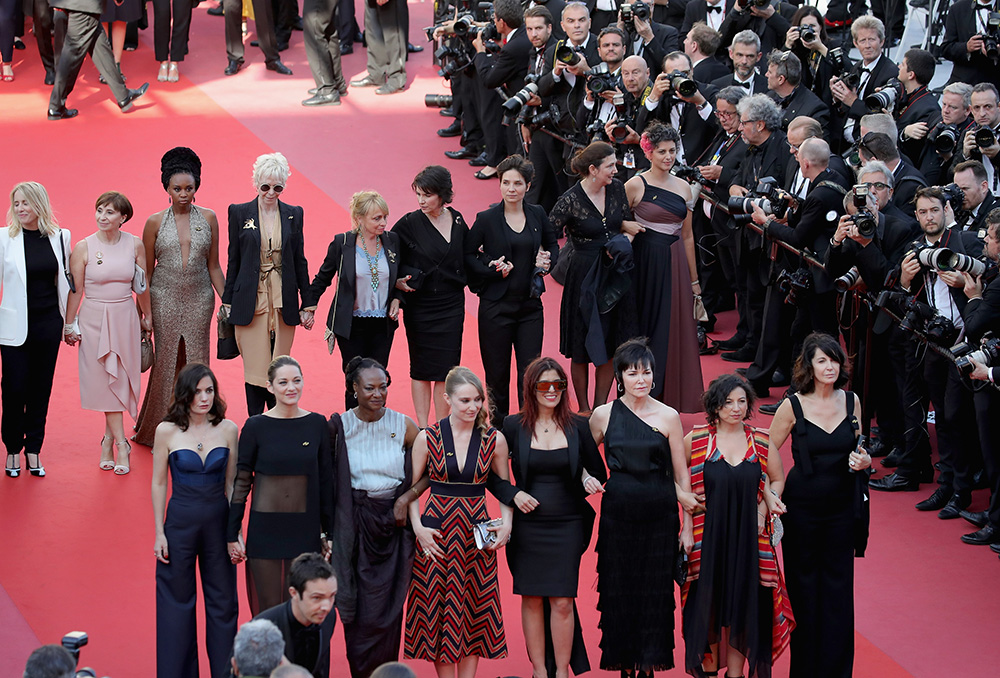 Female filmmakers on the red carpet in protest of the lack of female filmmakers honored throughout the history of the festival. Photo by Andreas Rentz/Getty Images