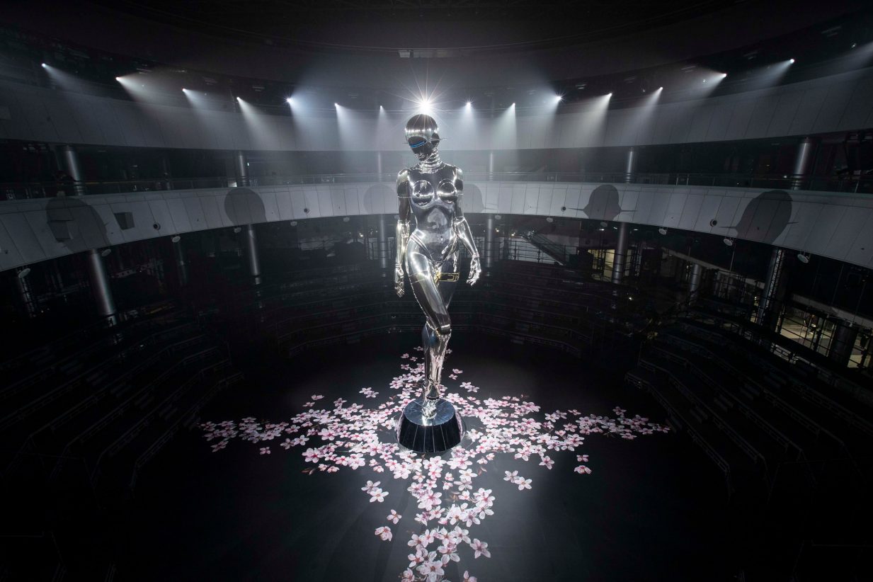 The robot was displayed with graphics of pink cherry blossoms on the surrounding floor