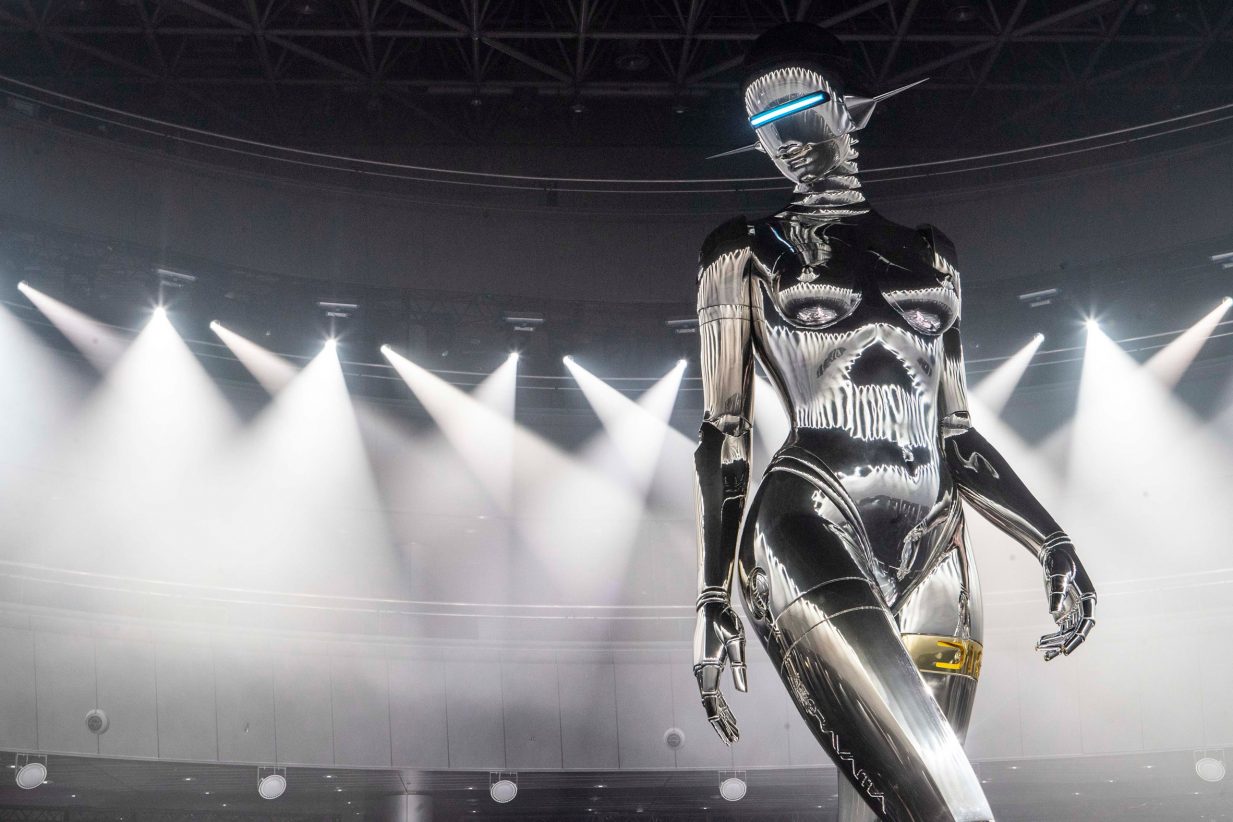 The robot's head resembles a helmet with a single illuminated rectangular slit for an eye and antennae for ears