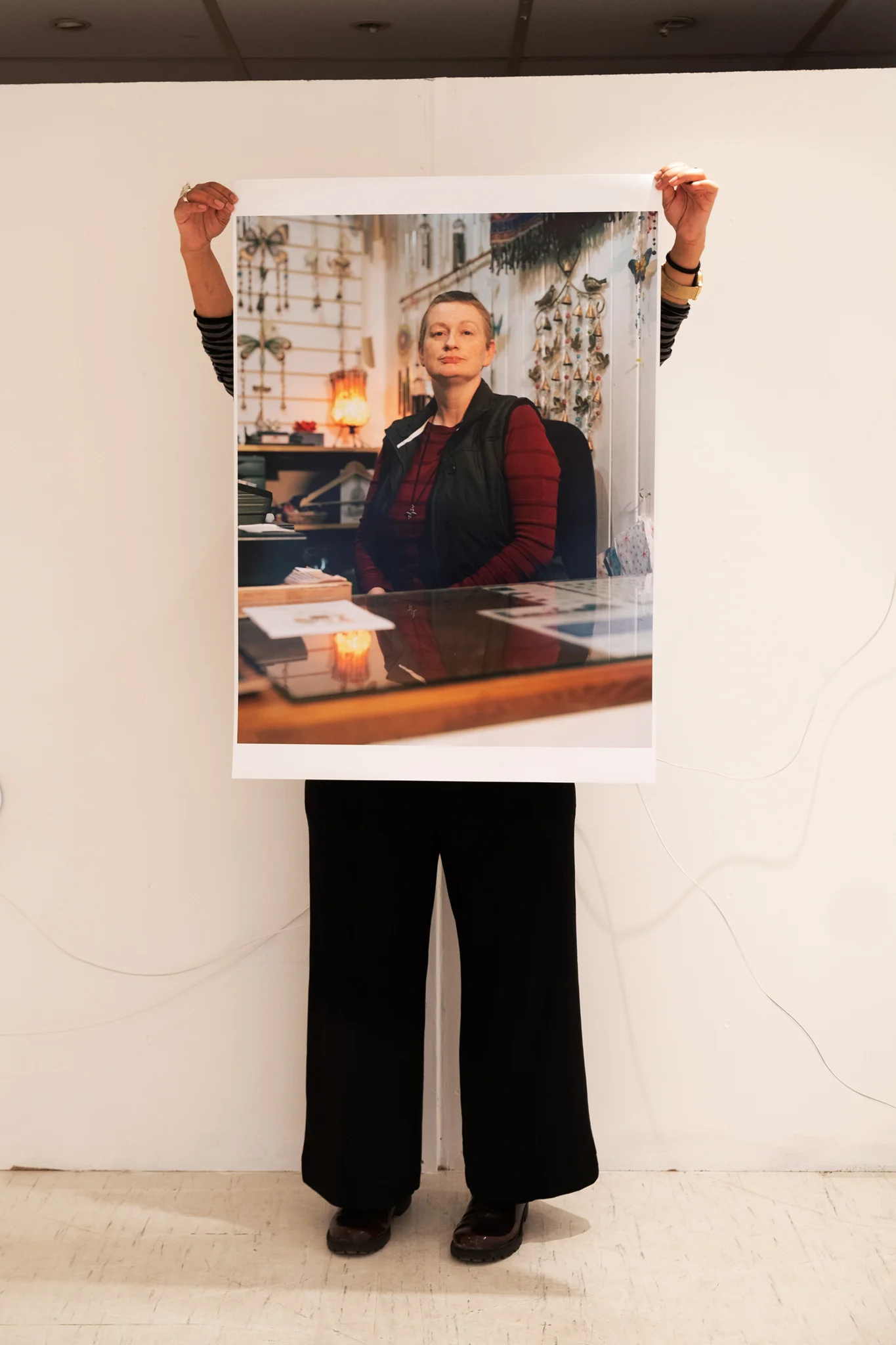 ‘B’ holding up the A1 sized print of Carol, Croydon Buddhist Centre in THE LOFT exhibition space. Taken by Graham Land, 29th March, 2019