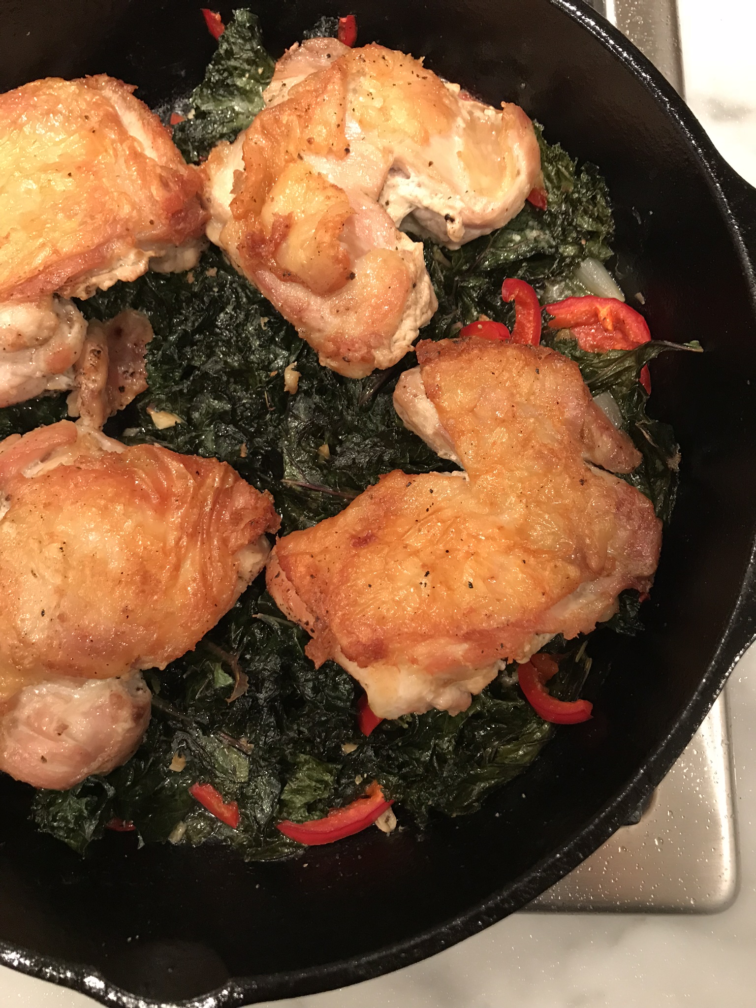 Crispy Chicken Thighs with Braised Kale and Creamy Polenta