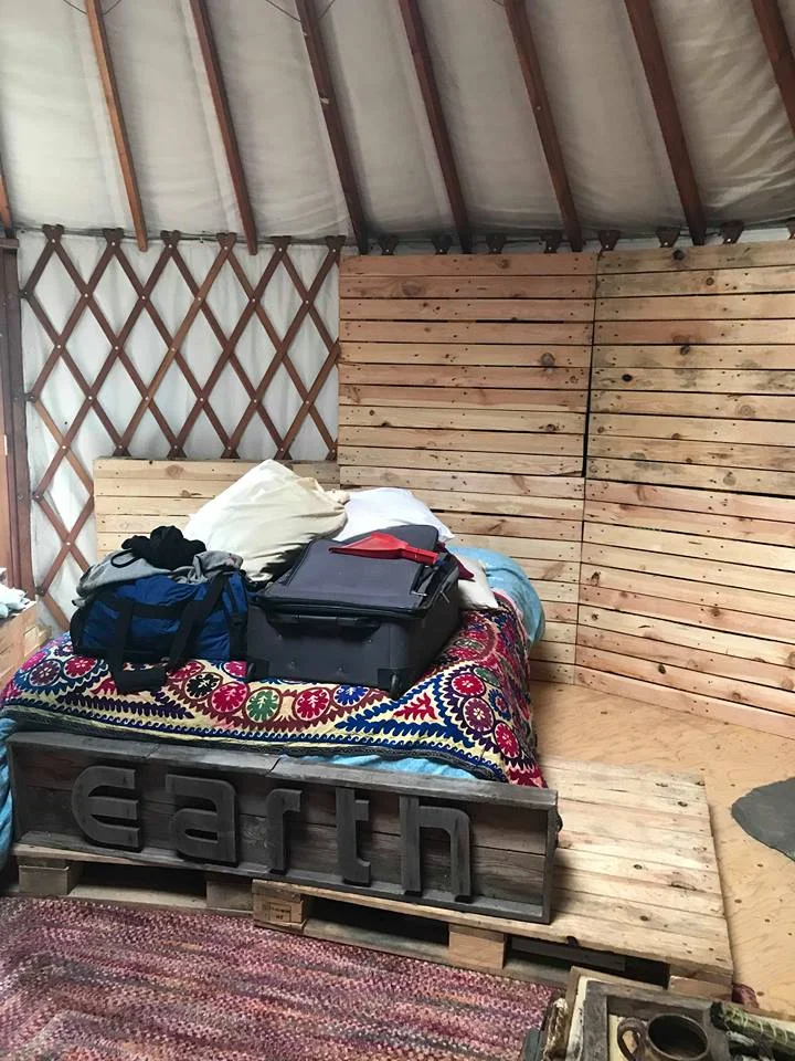 The chaotic process of creating make shift insulated walls with shipping pallets