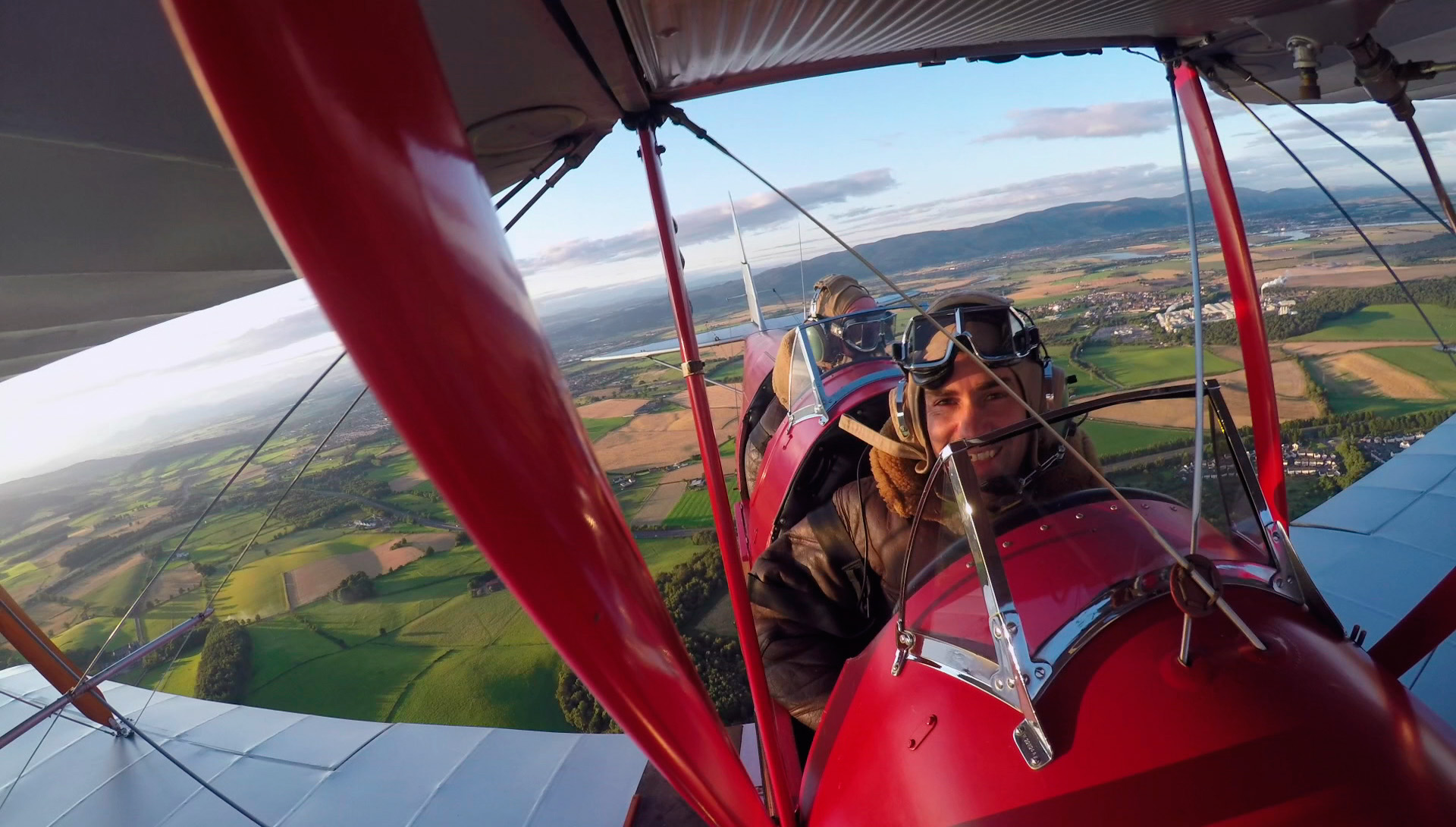 James Crawford in Tiger Moth filming Scotland from the Sky