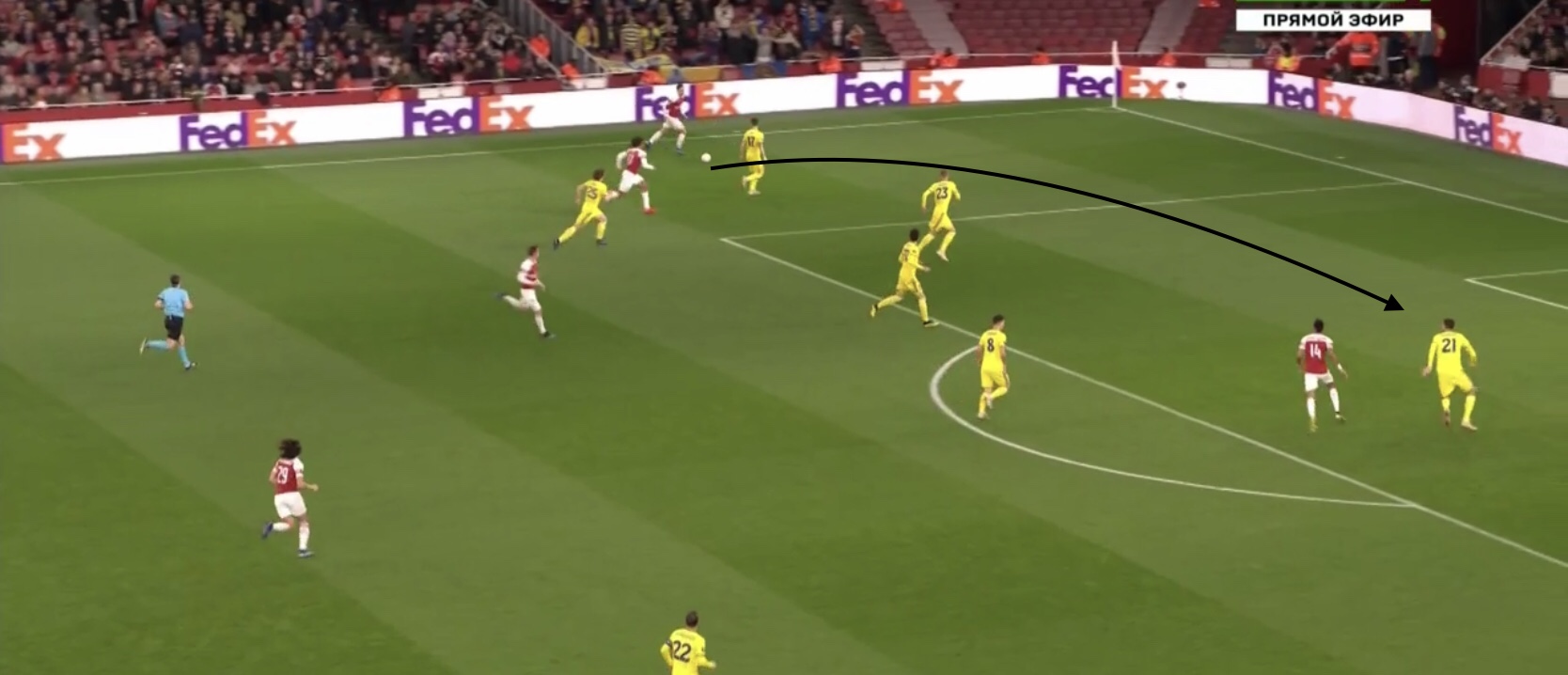 Ozil on the sideline with his body facing the field and head up is able to spot the run of Aubameyang.