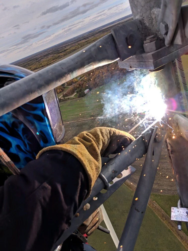 AustinVH_welding at 280' on a 480'GuyedTower_ModWork_GryglaMN_April2019.jpg