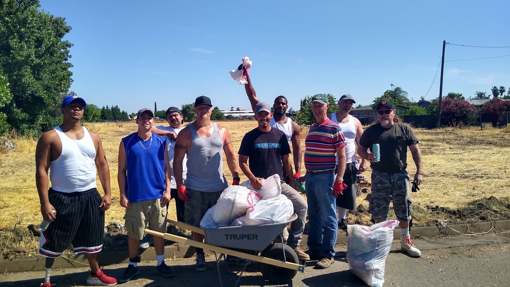 men working to clean up field.jpg