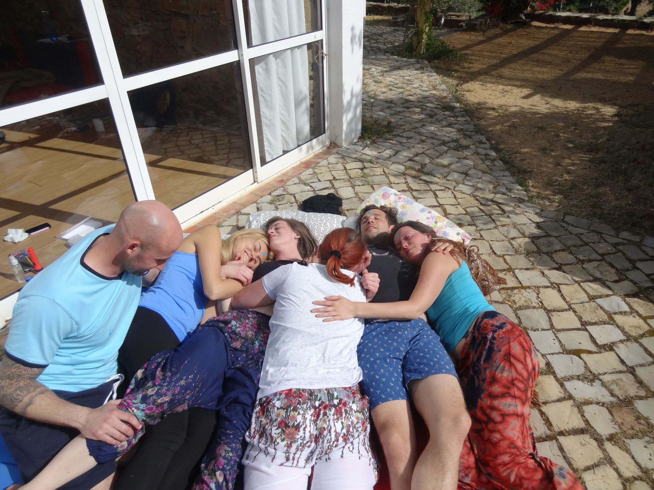  Humans loving other humans just because. The inevitable cuddle pile at our Portugal healing retreat.  