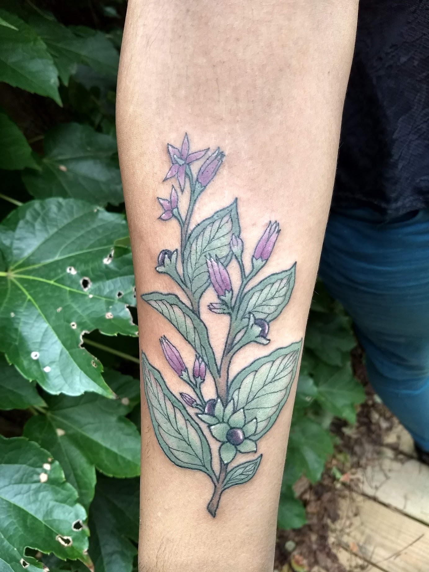 Black Ink Flowers Tattoo On Left Half Sleeve