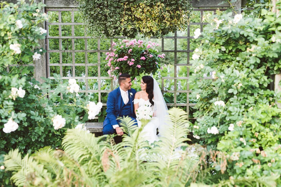 Bride and groom in Rose Garden at Chicago Botanic Garden.