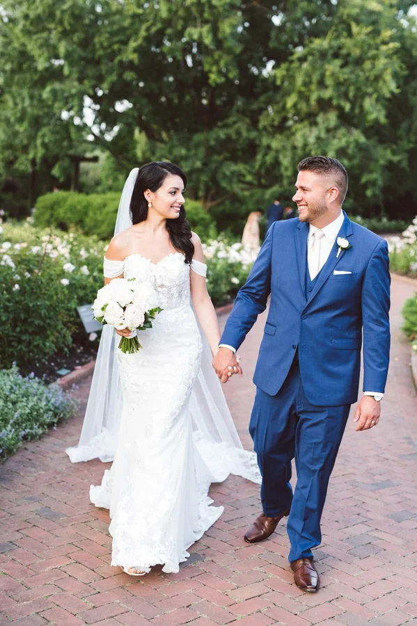 Bride and groom walking around at Chicago Botanic Garden.
