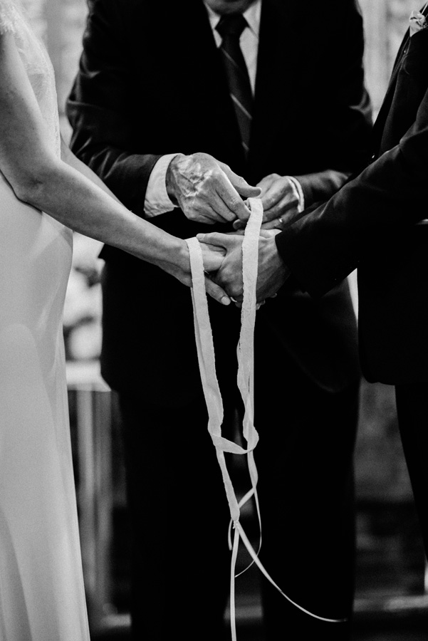 Bride and groom Irish hand tying tradition.