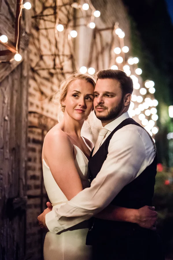 Bride and groom nighttime portrait at Salvage One.