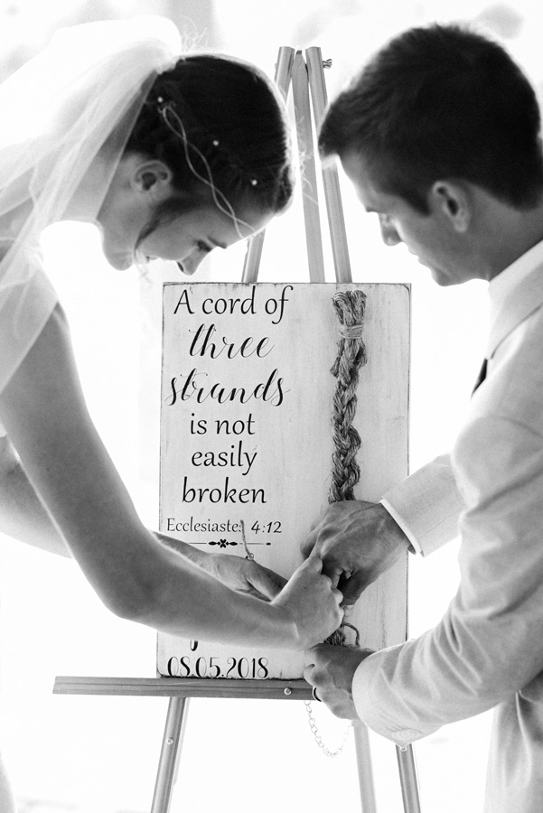 Bride and groom tie the knot.