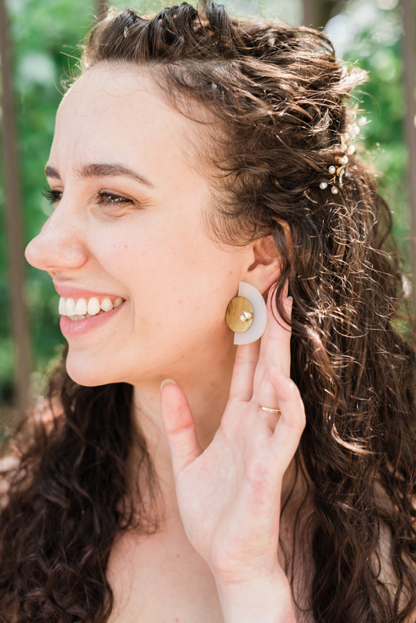 Portrait of bride and earring detail.