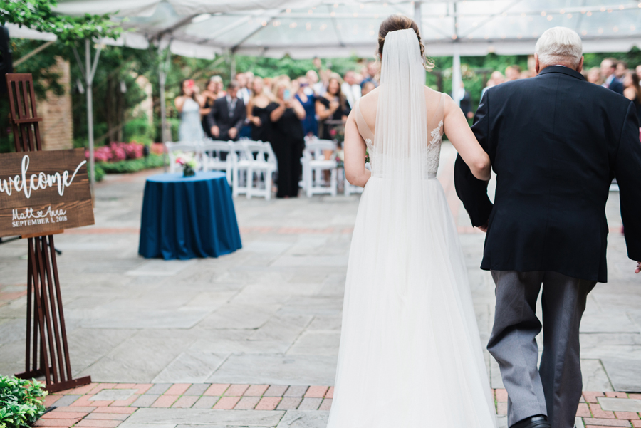 Bride and her grandpa walk down the aisle.