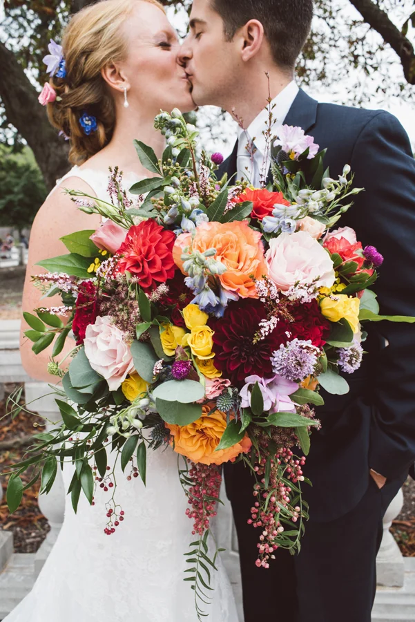 Bride and groom kiss.