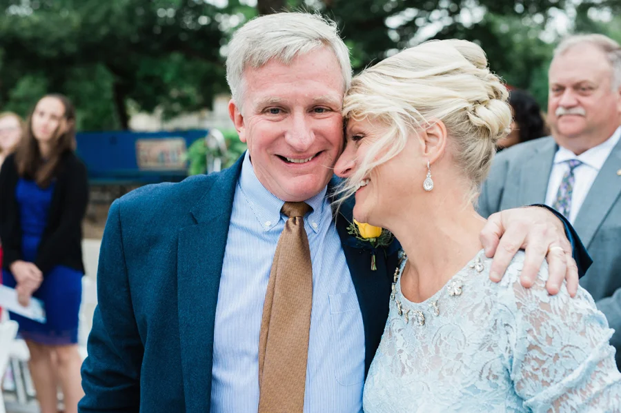 Mom and dad react during wedding ceremony.