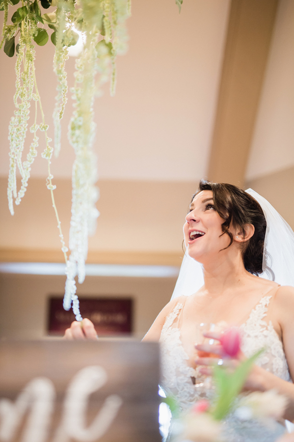 Bride reacts to her reception decor.