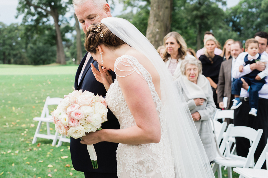 Bride reacts during processional.