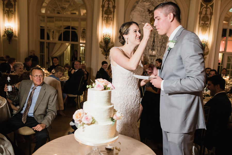 Bride and groom cut the cake.