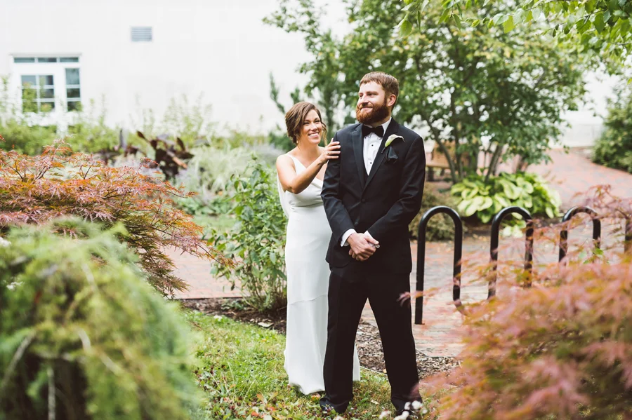 Bride and groom first look at Kalamazoo college.