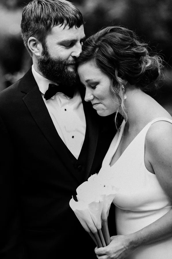 Groom kisses his wife.