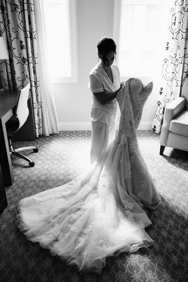 Bride gets in dress.