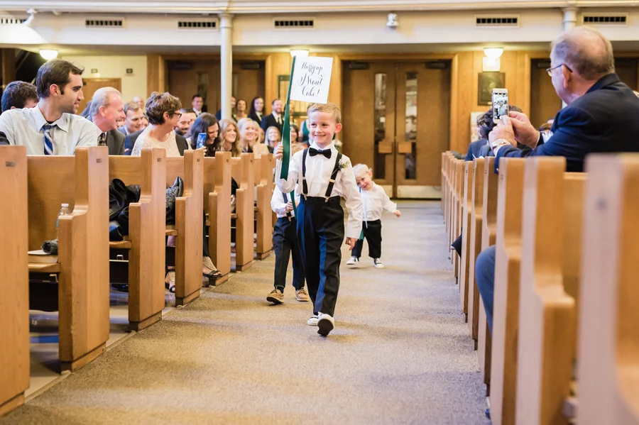 Ringbearers walk down the aisle.