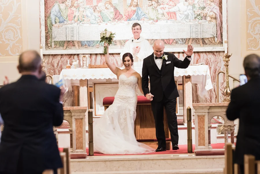 Bride and groom exit church.