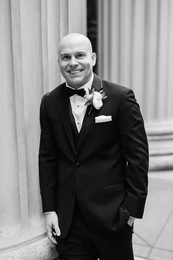 Black and white portrait of groom.