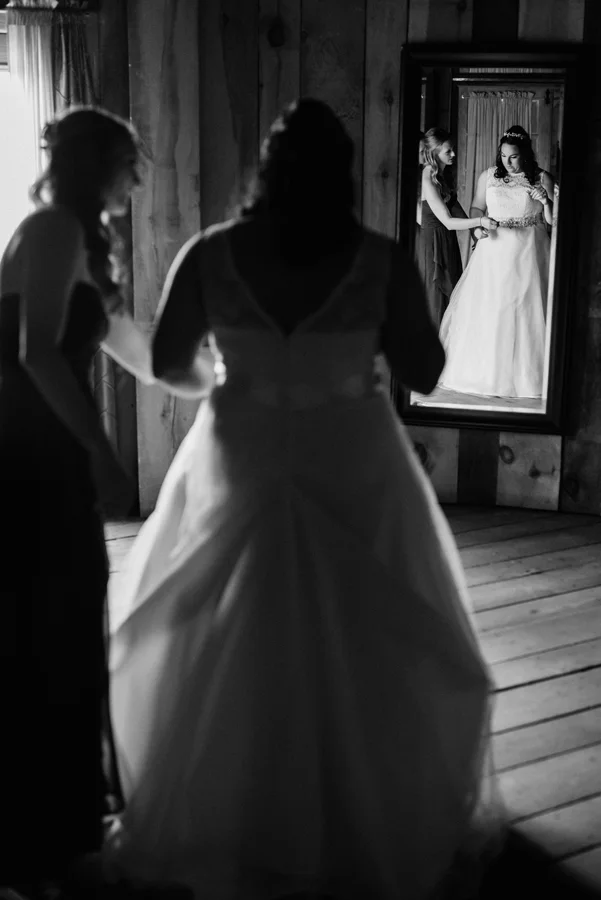 Bride gets in her dress.