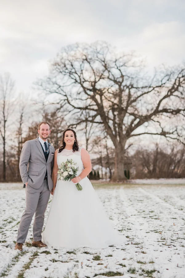 Bride and groom in snow.