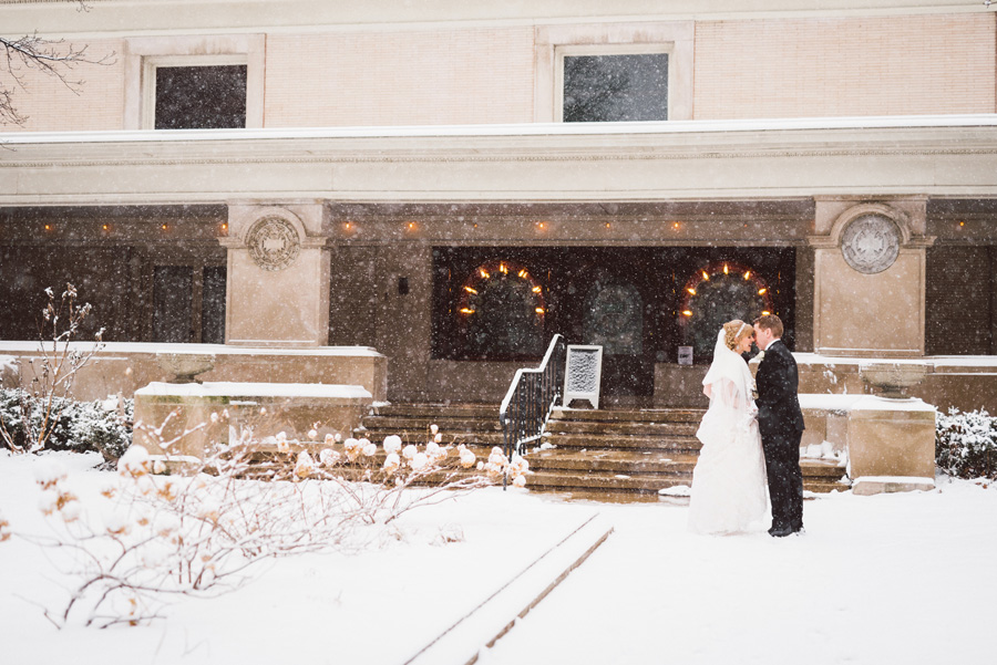 Bride and groom on a snowy day.