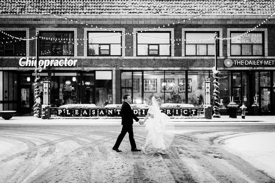 Bride and groom downtown Oak Park on a snowy day.
