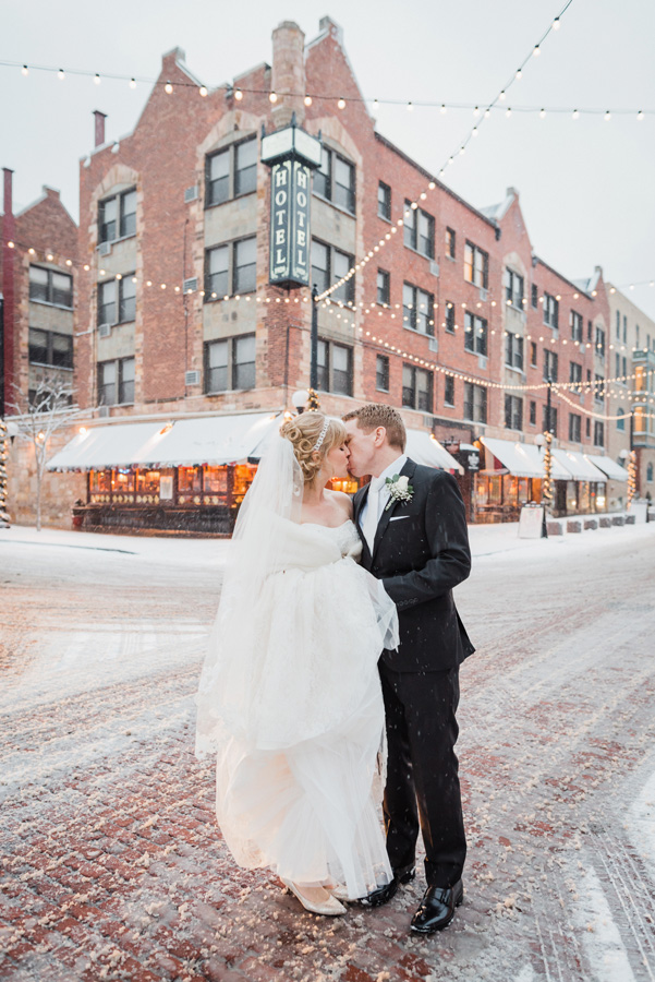 Bride and groom downtown Oak Park on a snowy day.